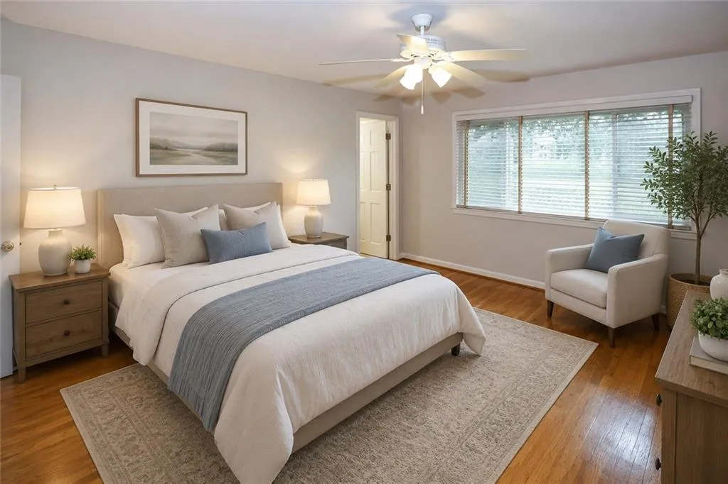 Virtual Spacious bedroom featuring hardwood-floor, a ceiling fan with integrated lighting, multiple windows with blinds, and light gray wall paint