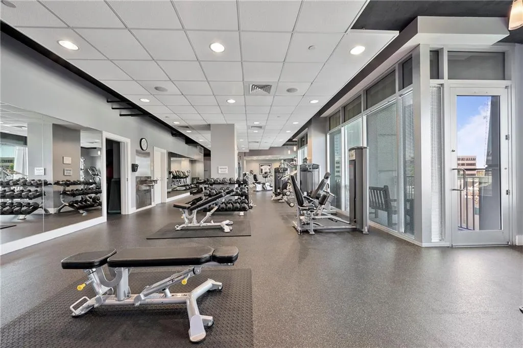 Exercise room with a drop ceiling and recessed lighting