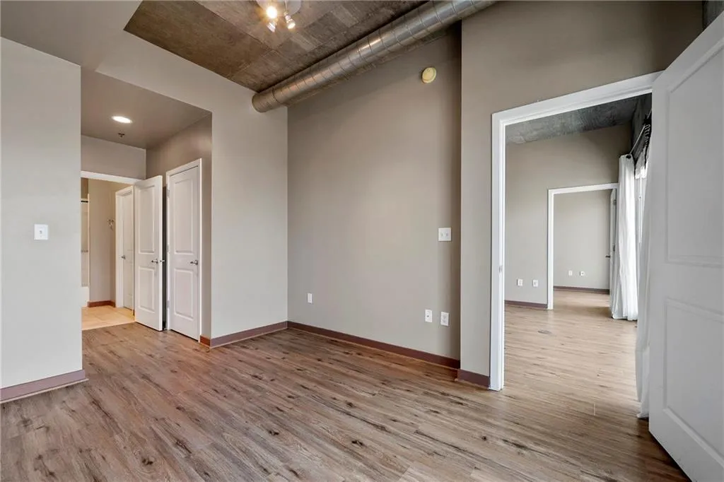 Bedroom featuring light wood-type flooring and baseboards