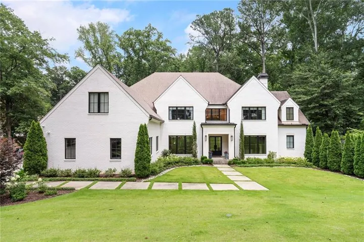 White brick exterior with dark-trimmed windows