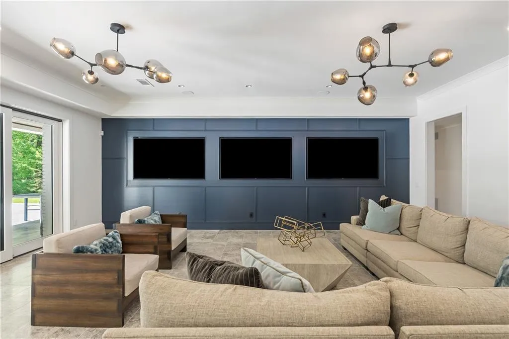 Three tv's provide an unbelievable theatre like experience, perfect for game day viewing. The sliding doors open fully to the outdoors blending the indoor and outdoor experience - perfect for the cool Fall and Spring weather!