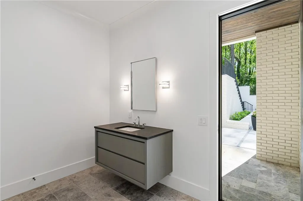 Bath is accessible from pool and outdoor shower area.  Washer and dryer hookups are also available.