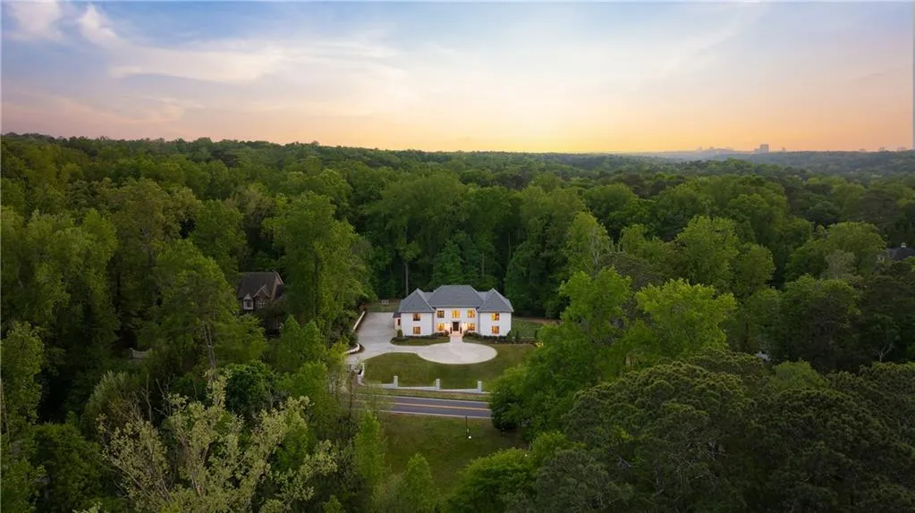 Stunning acreage in coveted location near Chastain Park.  Endless opportunities for expansion including pickleball, tennis courts, guest house, additional parking garage.