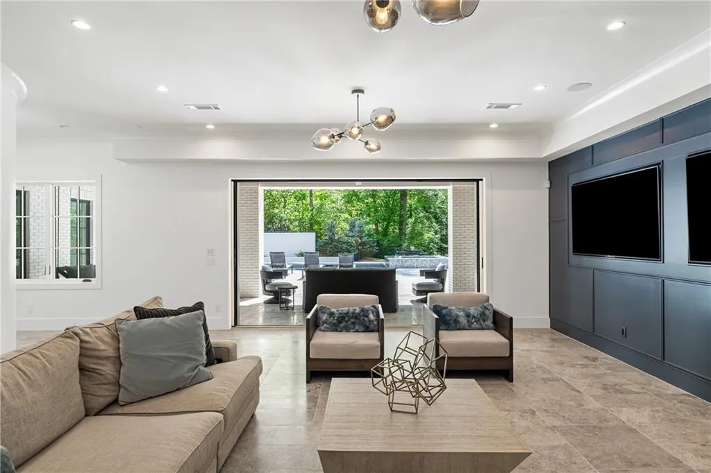 Sliding doors disappear into the walls for a seamless indoor and outdoor living experience