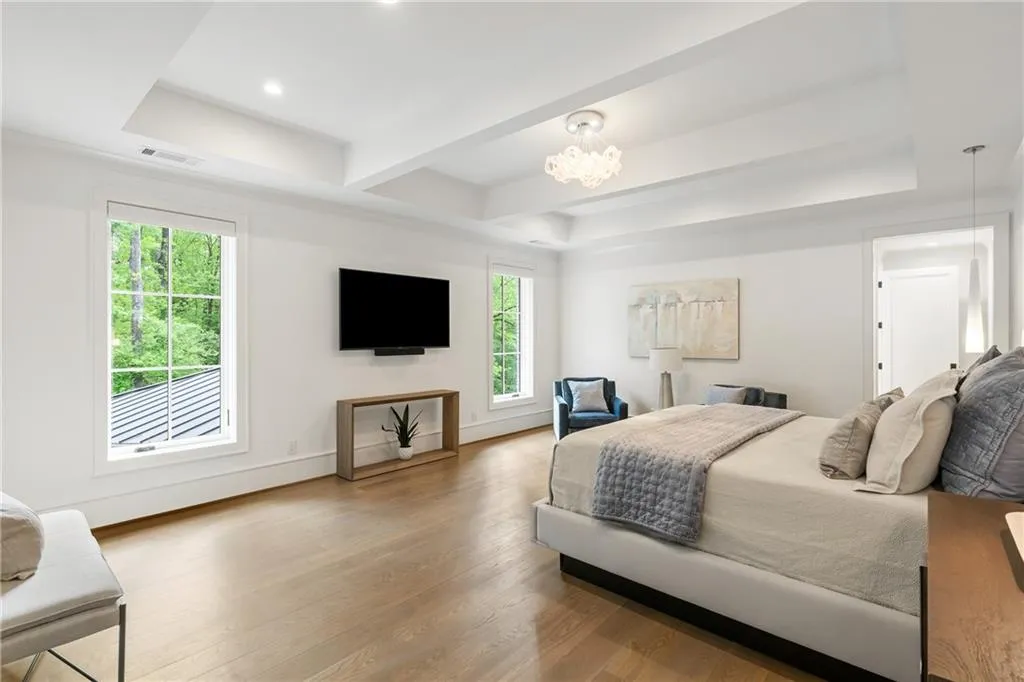 Beautiful trey ceiling and custom lighting in primary bedroom
