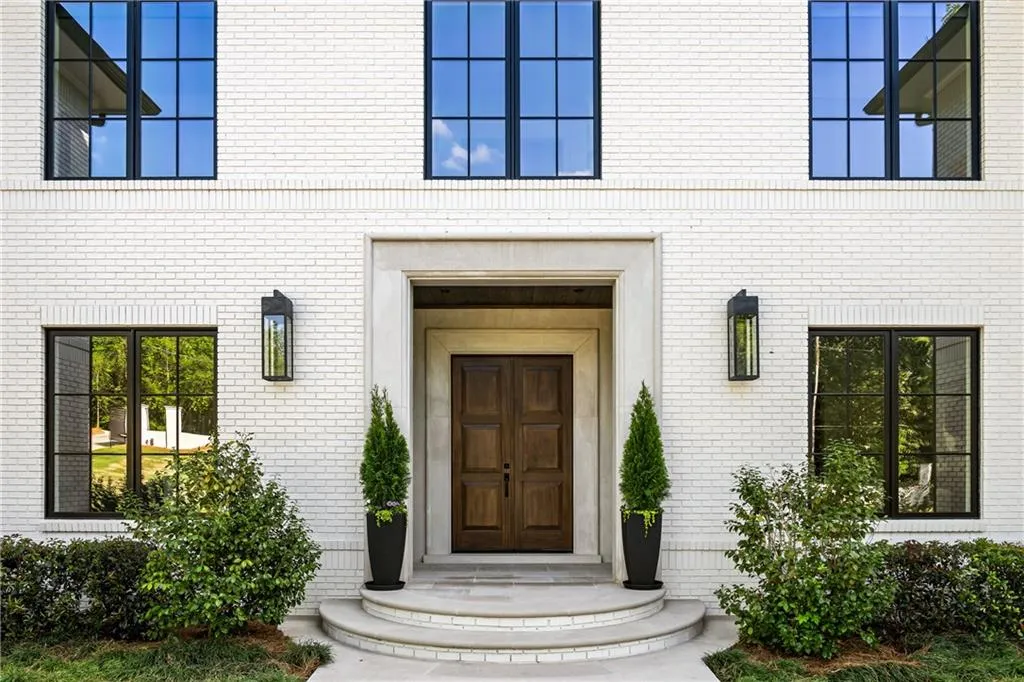 Limestone entryway with cedar doors