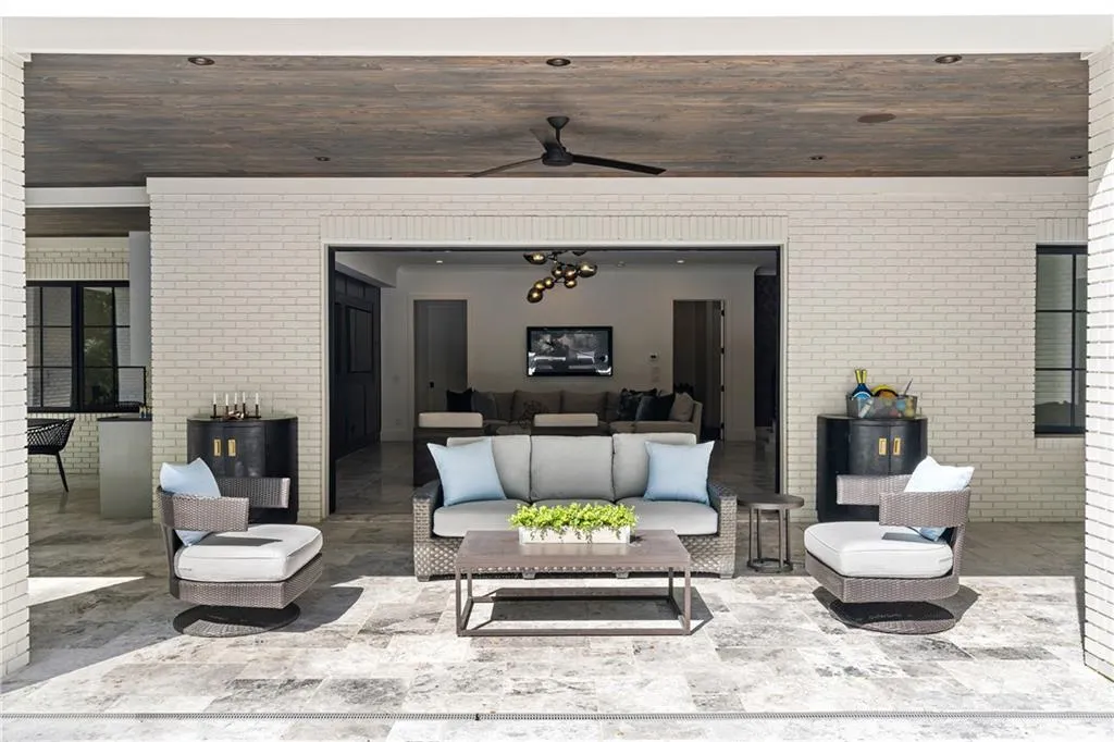 Covered patio off terrace level rec room