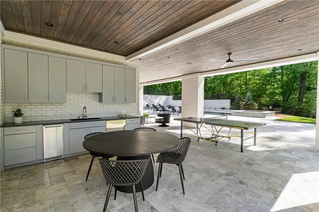 Kitchenette off covered patio conveniently located by pool and firepit