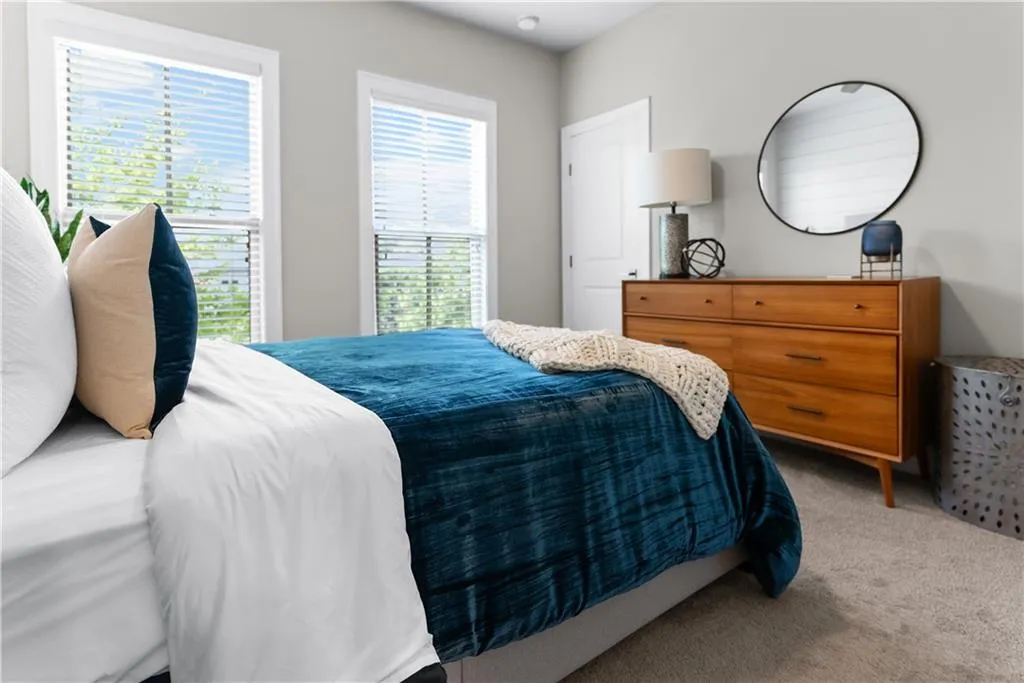 Full bathroom featuring toilet, shower / tub combo, and vanity