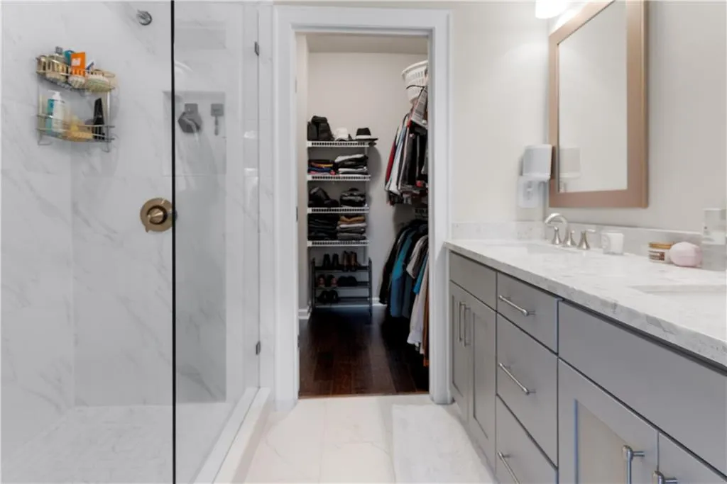 Bathroom with a shower with shower door