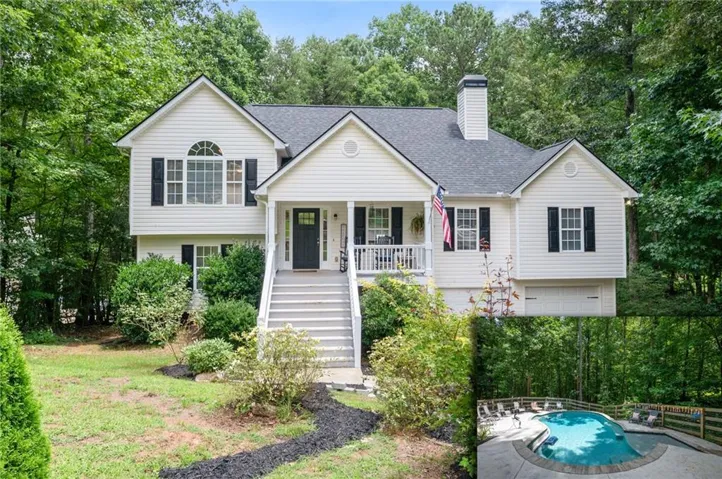 White siding residence featuring a covered front porch, arched window, dark shutters, and an attached garage