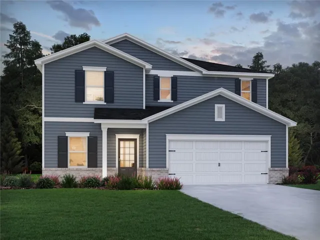 Two-story residence featuring blue siding, white trim, a gabled roofline, a two-car garage, and a covered front entry