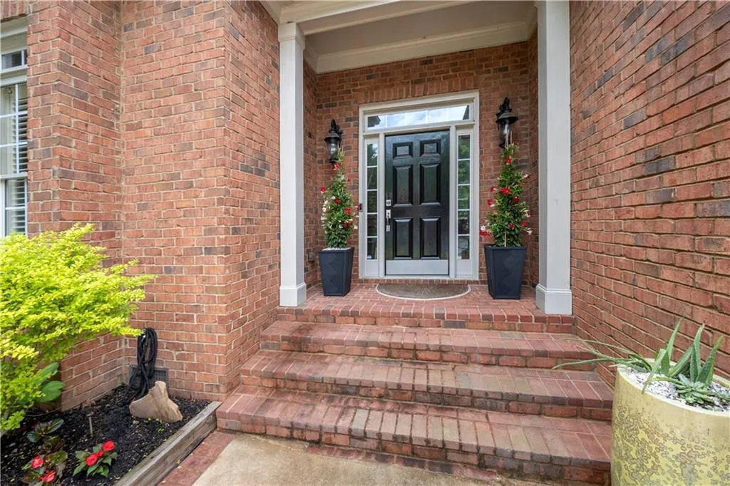 Property entrance with brick siding