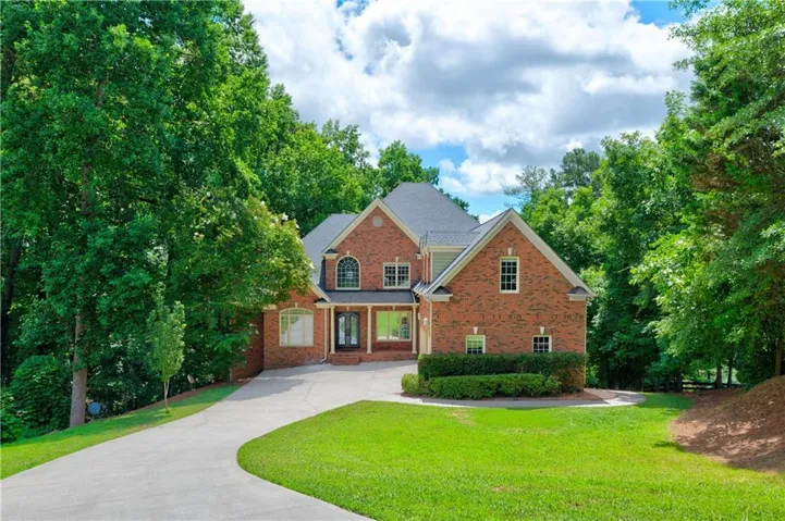 Red brick exterior with a dark gray shingle roof