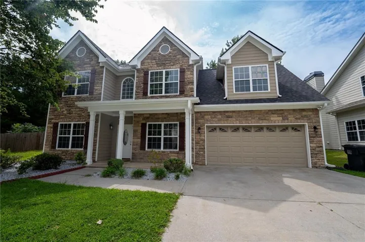 Stone and siding exterior with gabled roof lines