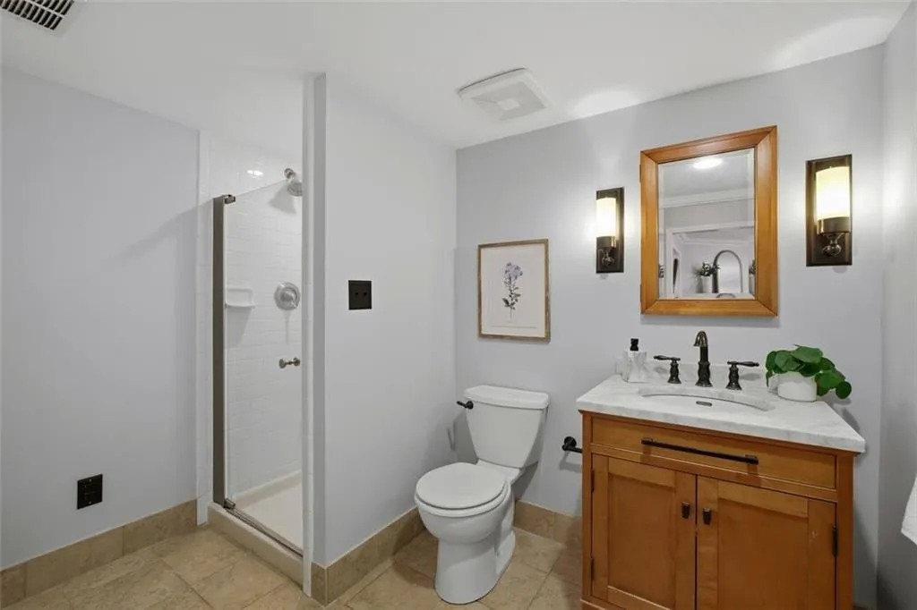 Full guest bathroom on the main level with walk-in shower