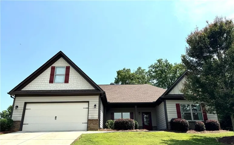 Traditional-style exterior with a gabled roofline and light-colored siding