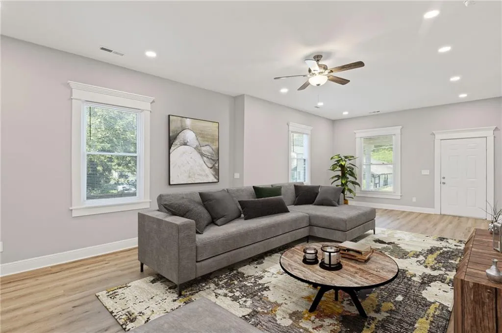 Virtually Staged-Living room featuring ceiling fan, plenty of natural light, light wood finished floors, and recessed lighting