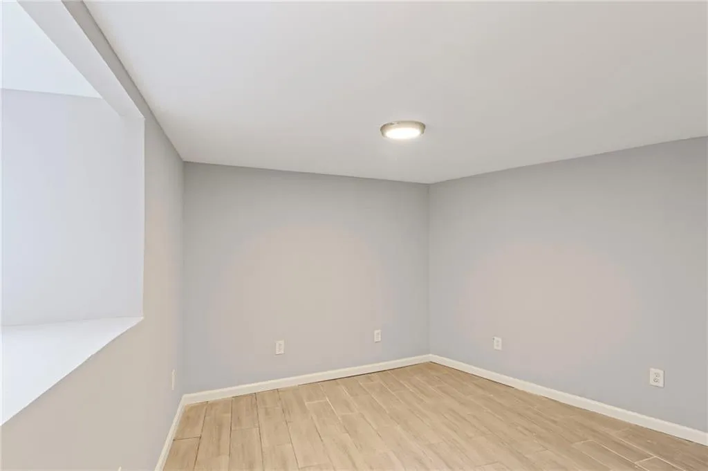 Spare room featuring light wood-style floors