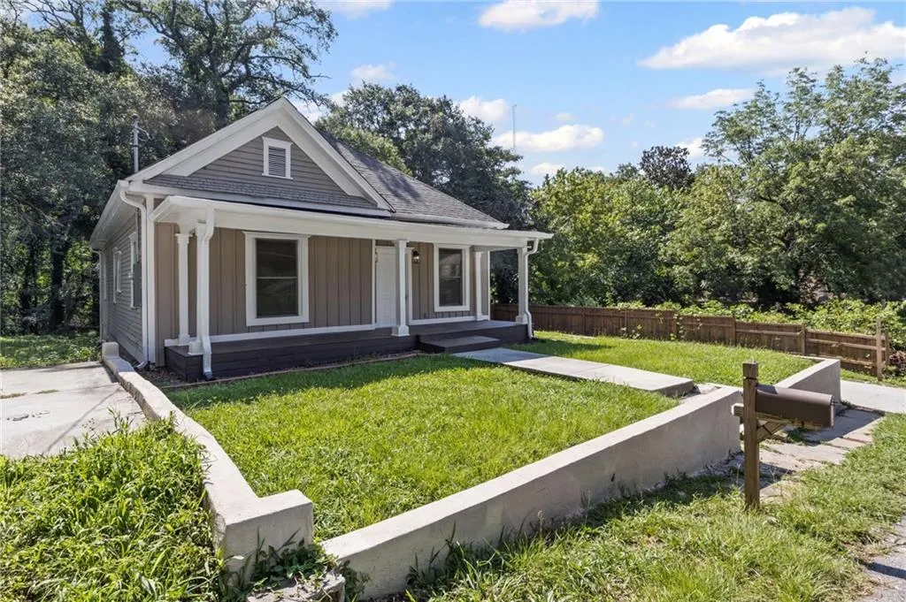 Bungalow-style house with covered porch and board and batten siding