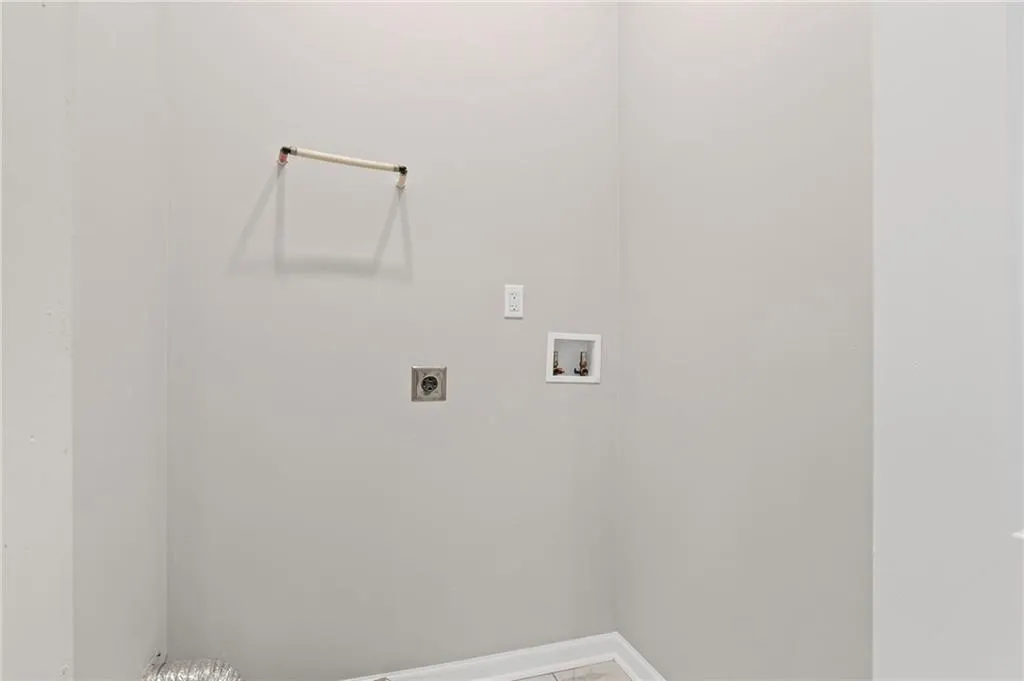 Laundry area featuring hookup for an electric dryer and washer hookup