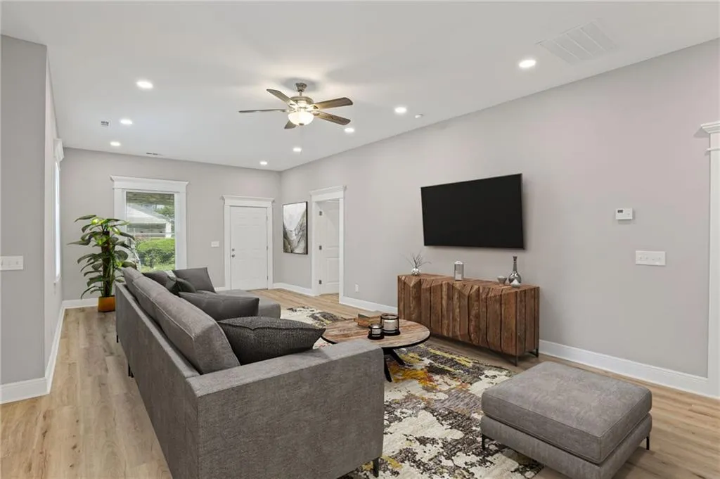 Virtually Staged-Living area with a ceiling fan, recessed lighting, and light wood-style flooring
