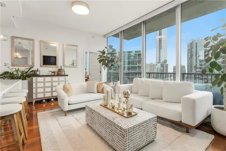 Floor-to-ceiling windows with balcony access