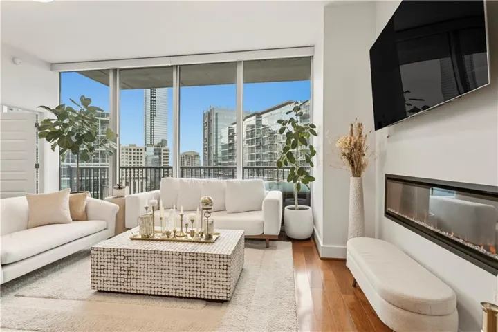 Floor-to-ceiling windows frame expansive Midtown views.