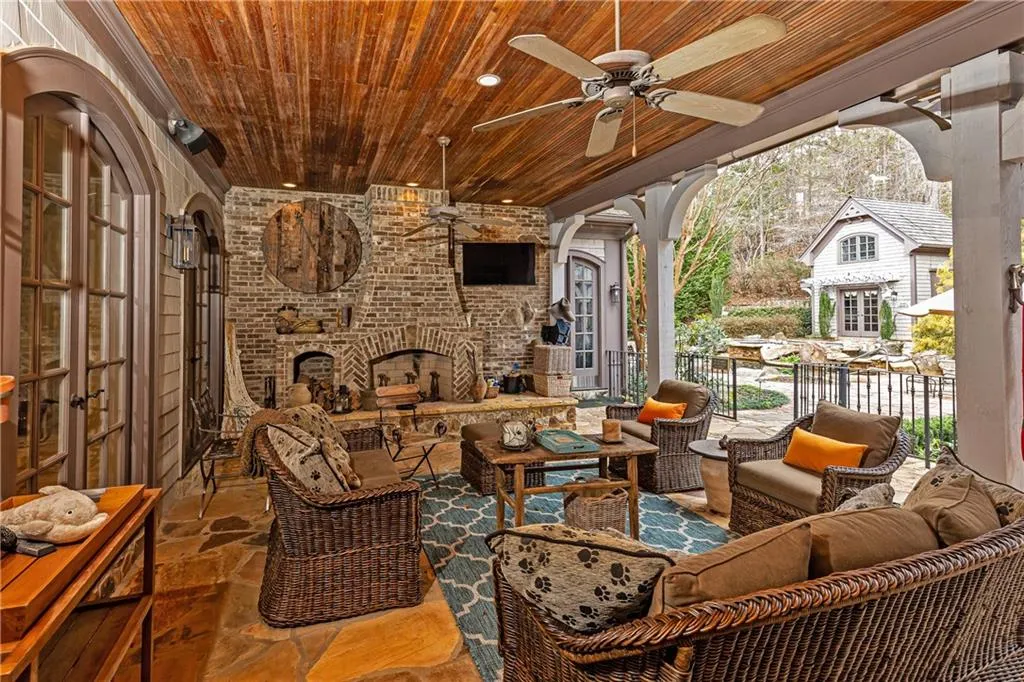 Fabulous Covered Flagstone Patio with fireplace can be accessed from foyer, living room/study, kitchen, family room and primary bedroom.