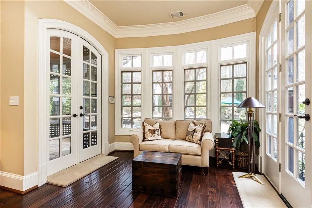 Sunny Primary Bedroom Sitting Area opens to right to backyard and to left Private Screened Porch.