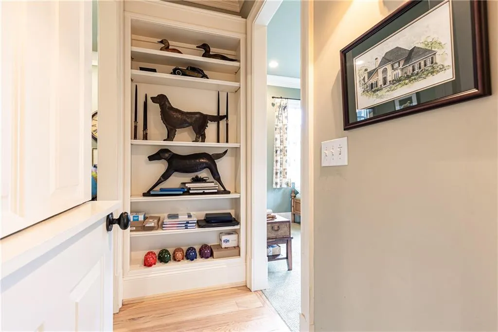 Dutch door accesses entry with built-in display case. To right is Secondary Bedroom on Main. To Left is current Office.