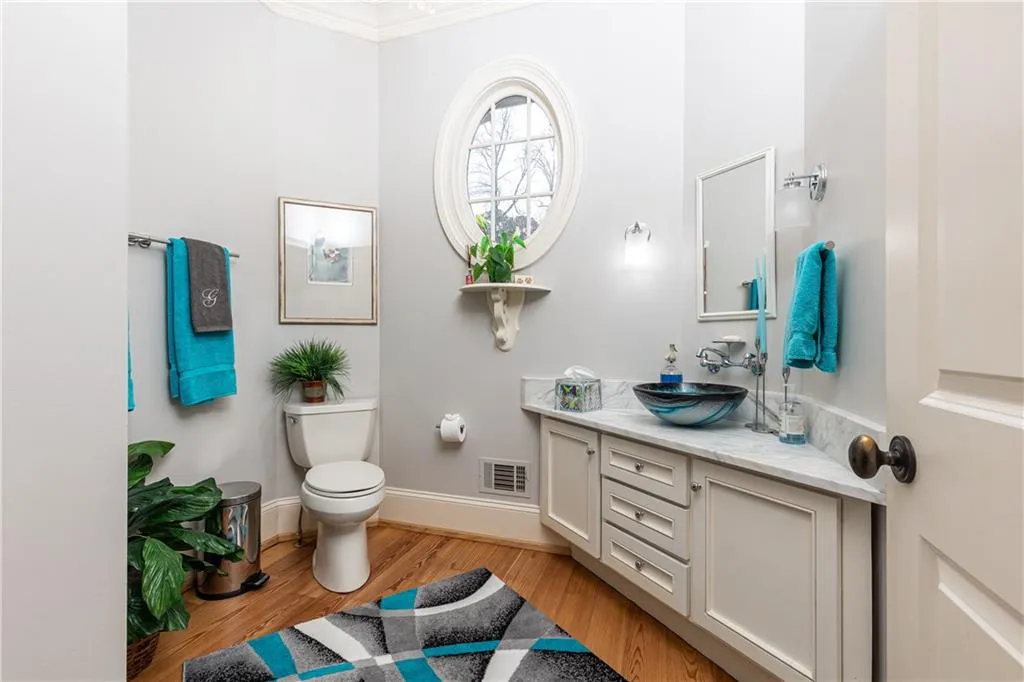 Designer Bath with shower serves guests and secondary bedroom on main.