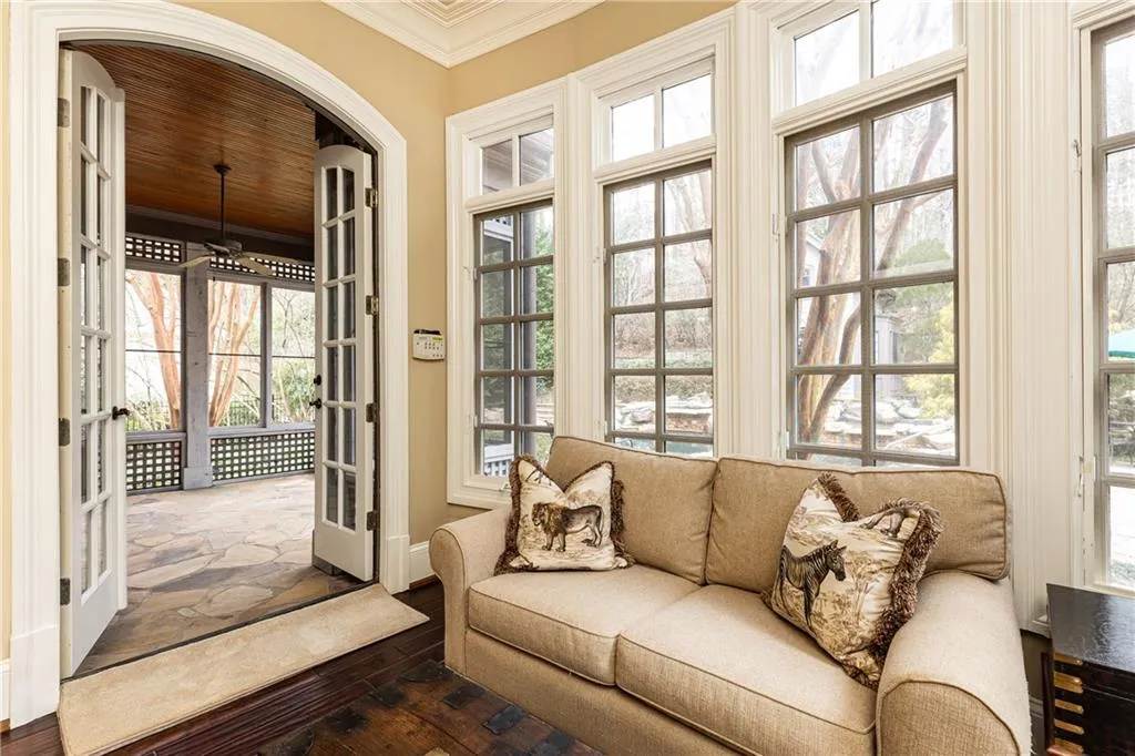 Sitting Area open to Screened Porch. Both overlook and access backyard Pool.