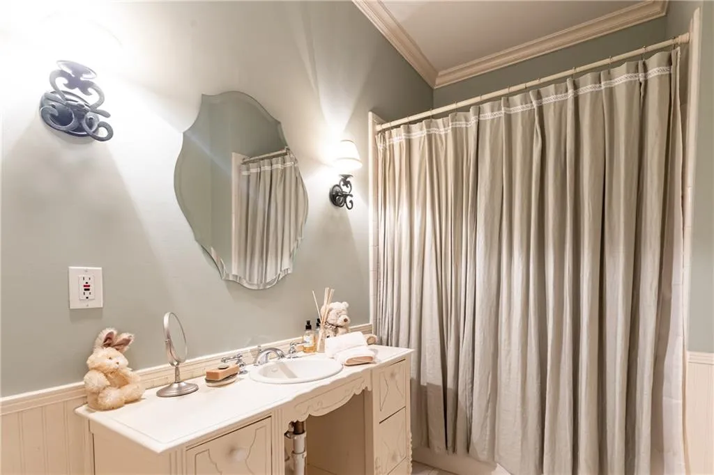 Secondary Ensuite Bath on upper level has tub/shower combination.