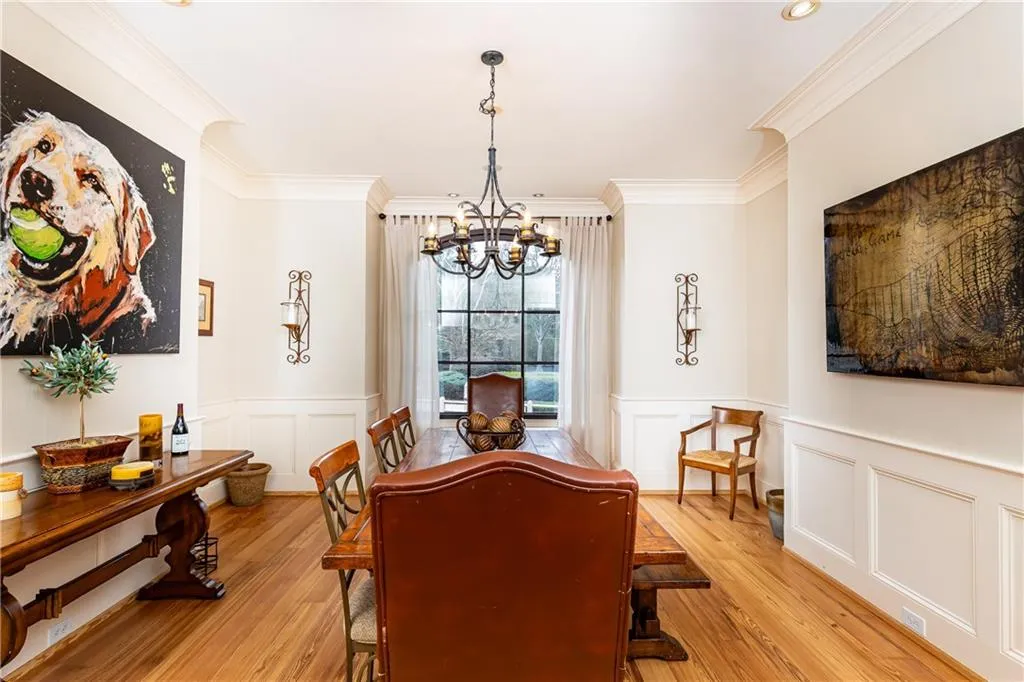 Formal Dining Room features exquisite mouldings and millwork found throughout the home.