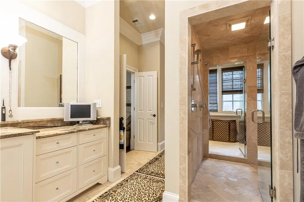 See Central Stone Shower with two shower heads.