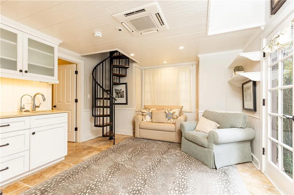 Guest House Living area with Kitchenette overlooks pool.