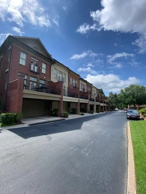 View of asphalt road featuring curbs