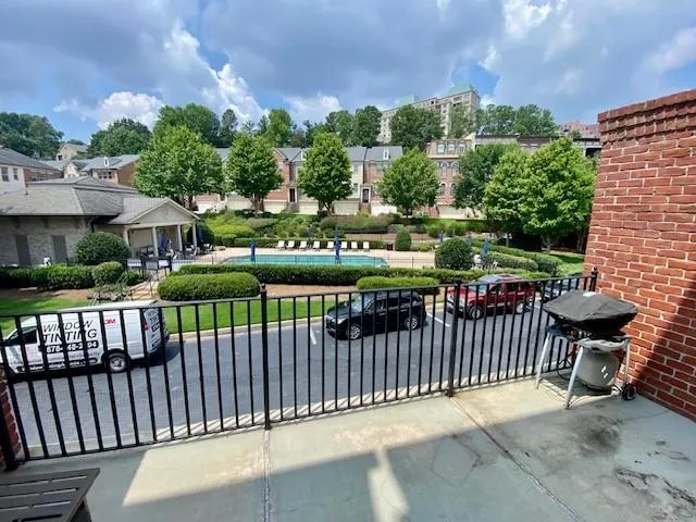 Gate featuring a residential view and a pool