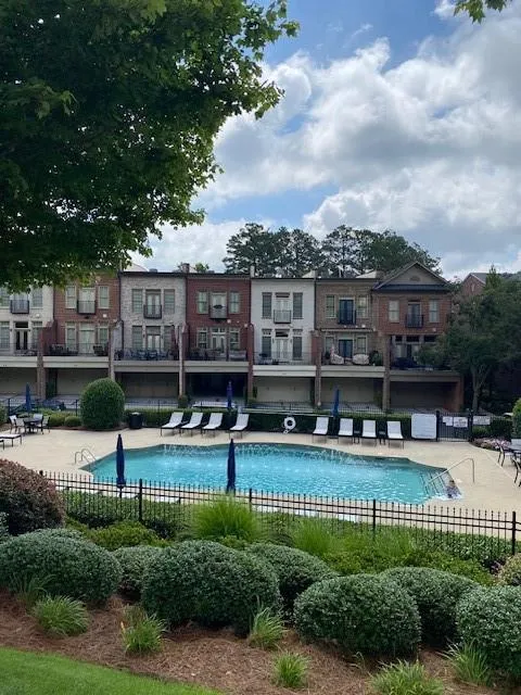 Community pool featuring a patio