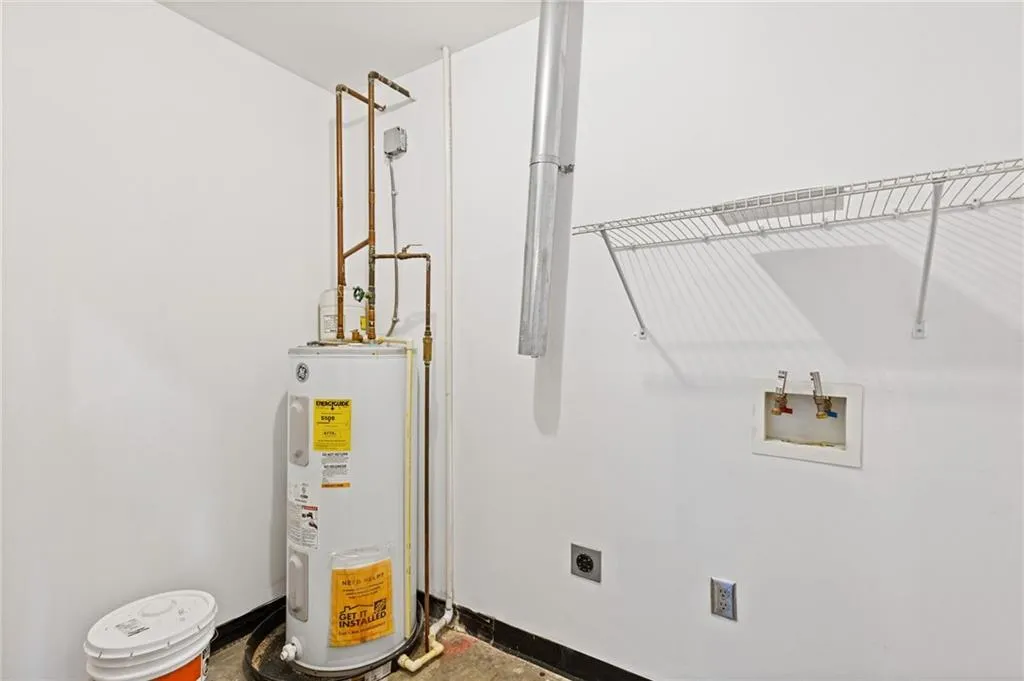 Laundry area featuring washer hookup and electric water heater