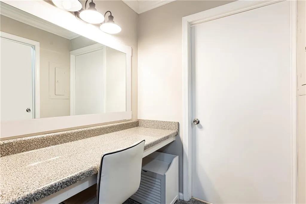 Separate vanity area outside of bathroom.