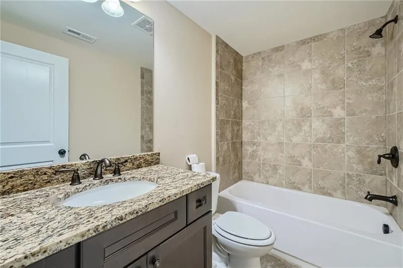 Full bathroom featuring bathtub / shower combination and vanity