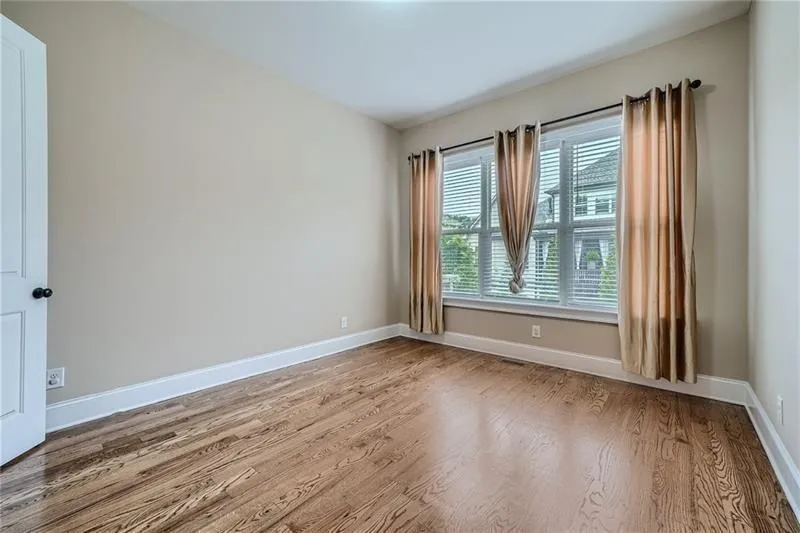 Empty room featuring light wood finished floors