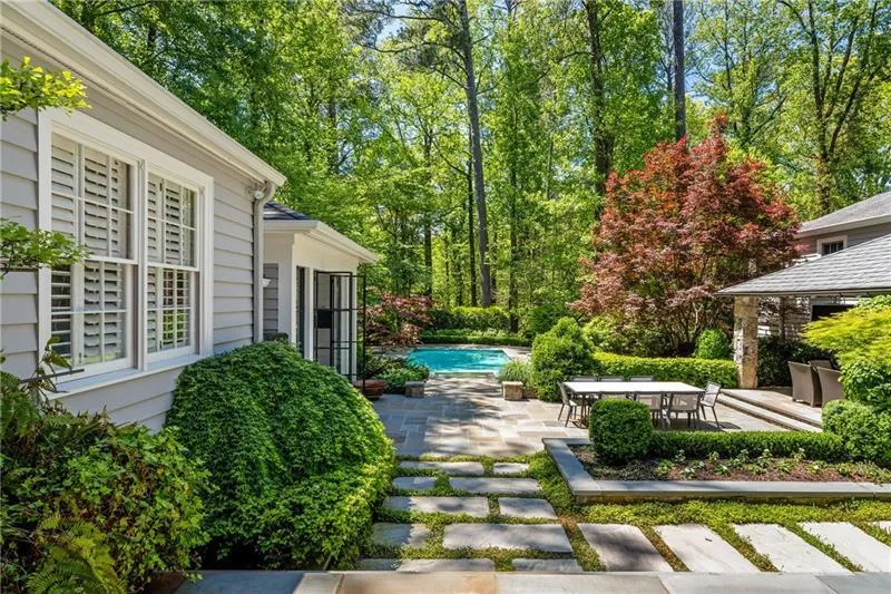 View of yard with a patio area, an outdoor pool, and outdoor dining space