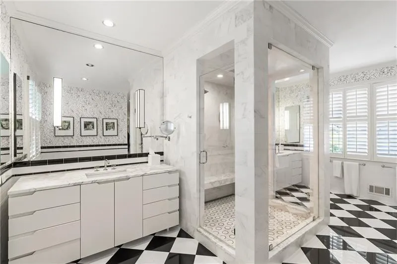 Bathroom featuring a shower stall, ornamental molding, vanity, recessed lighting, and tile walls