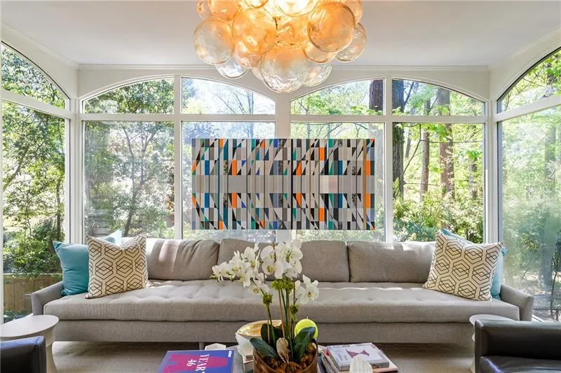 Sunroom with a chandelier and plenty of natural light
