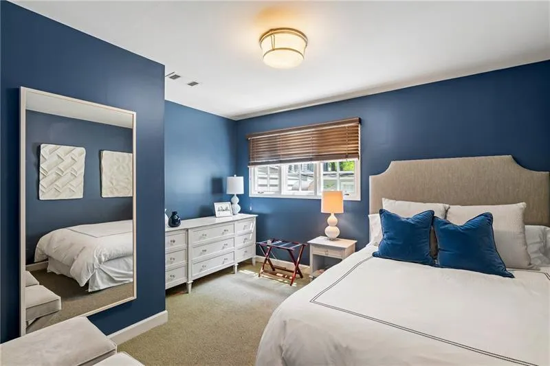 Carpeted bedroom with baseboards