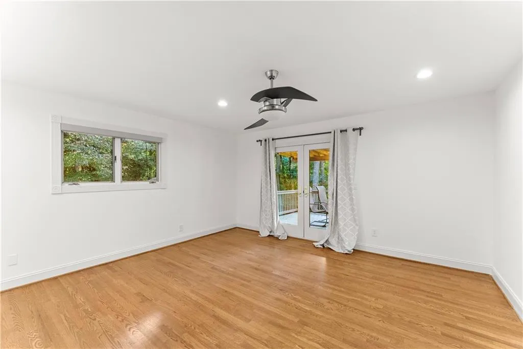 Unfurnished room featuring french doors, light wood-style floors, recessed lighting, and a ceiling fan