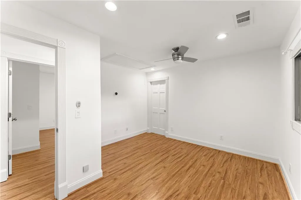 Empty room featuring recessed lighting, light wood-type flooring, and ceiling fan